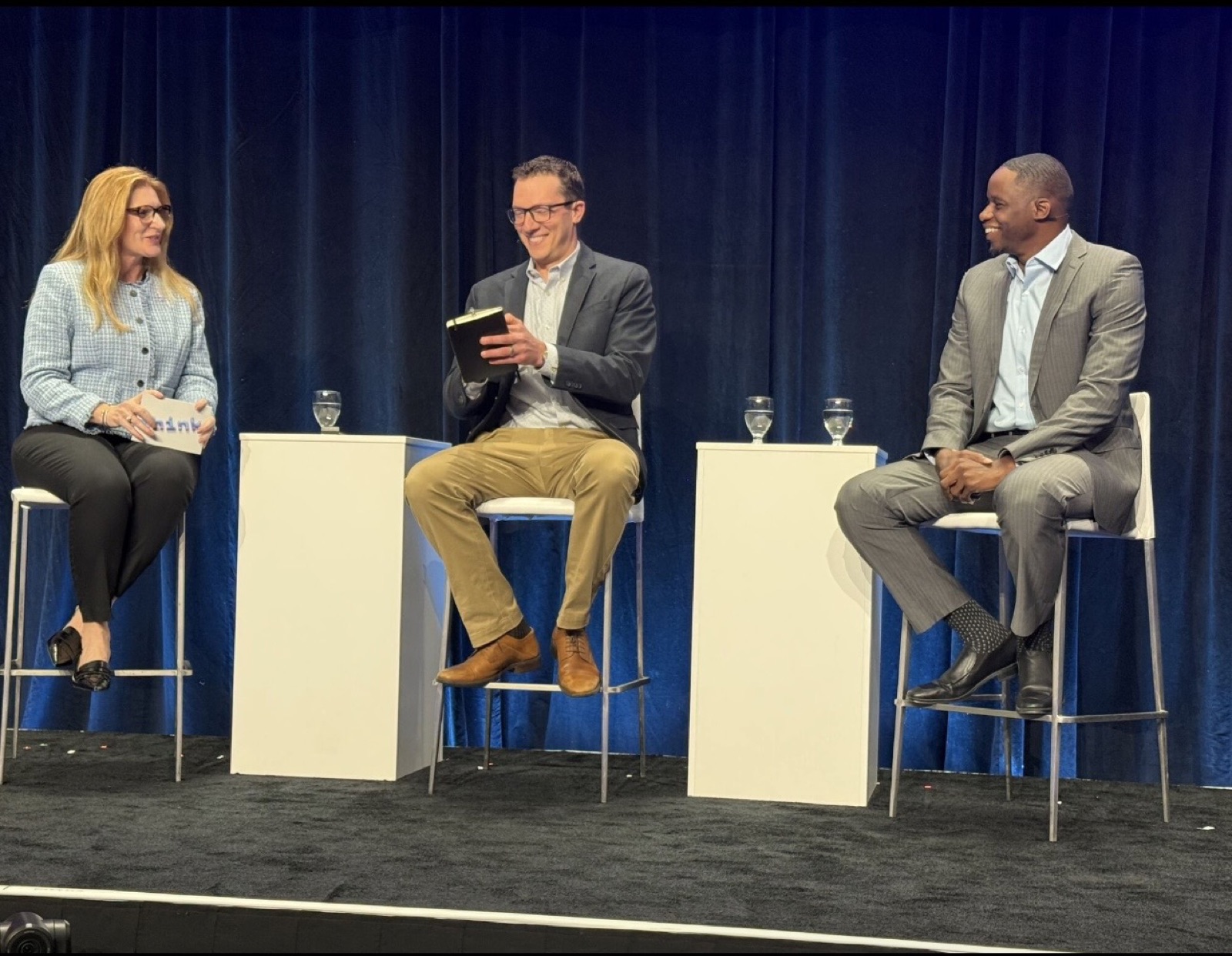 Michael Conward, Ph.D., on stage at IBM THINK 2026 for a panel on enterprise AI agent governance